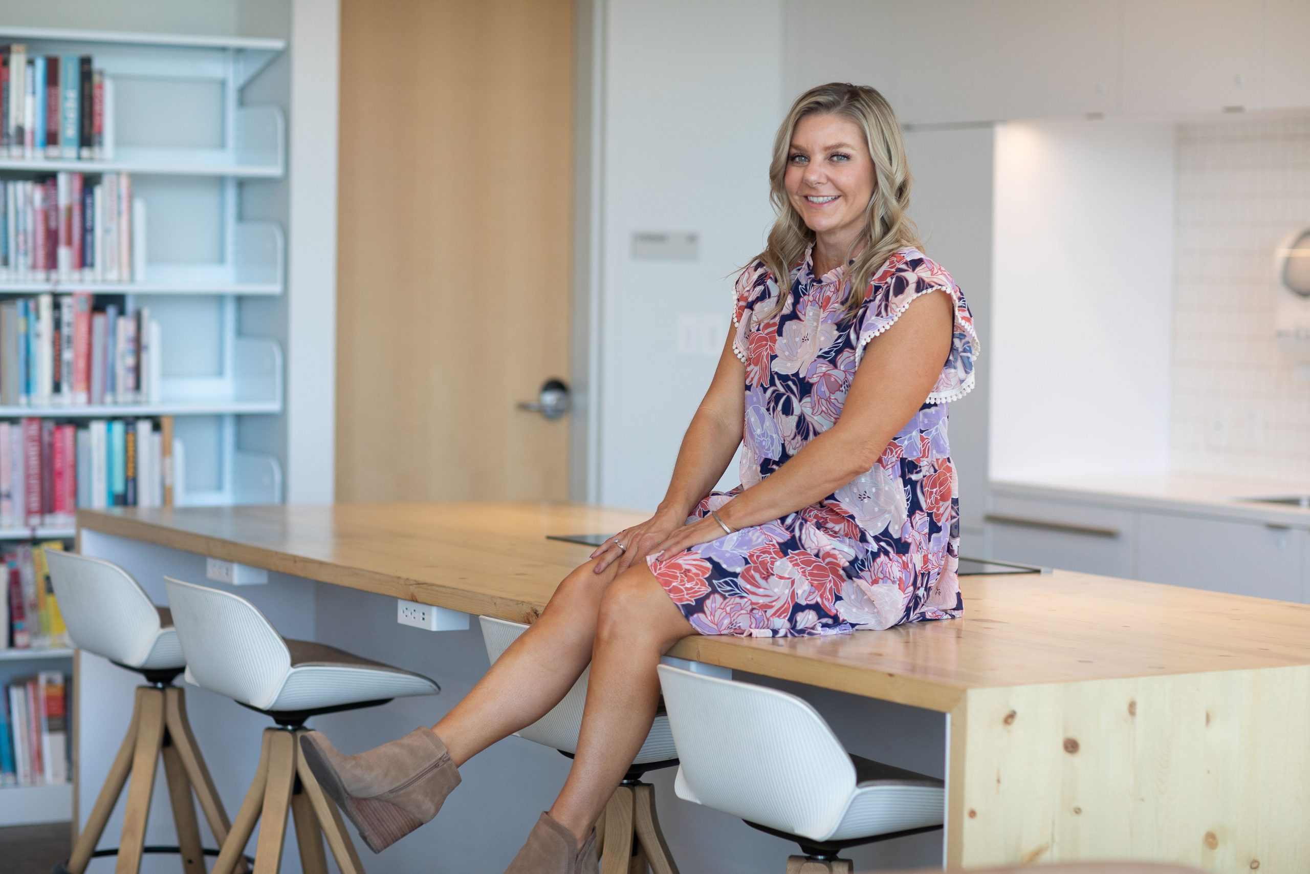 Sara sitting on a desk